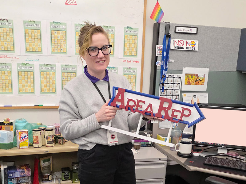 WEU Area Rep Samantha Kasper holding sign