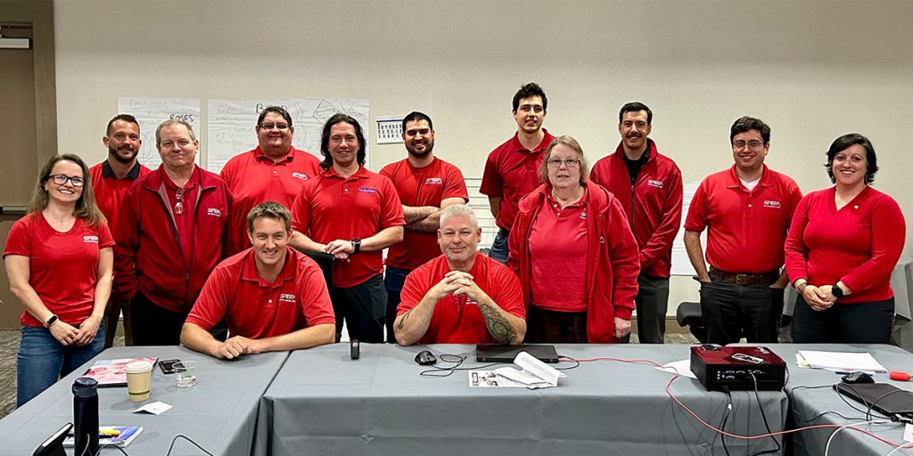 Prof and Tech Negotiation Teams and guests on Red-Shirt Wednesday